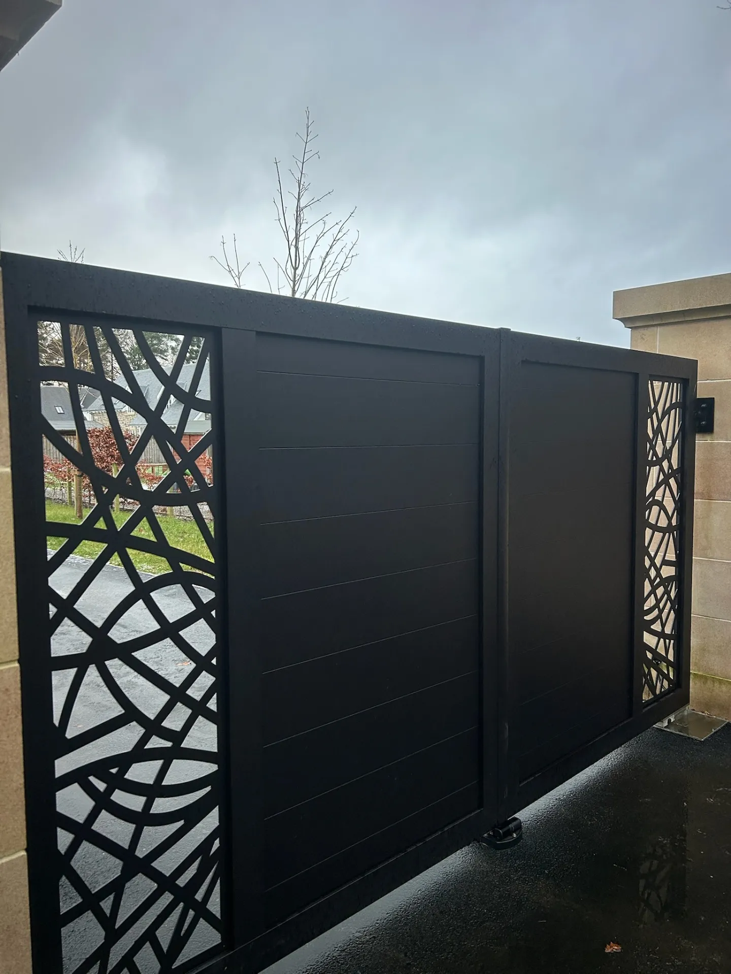 Bespoke aluminium laser-cut decorative swing gates with horizontal slatted infill installed in Scotland by KLR Design Limited